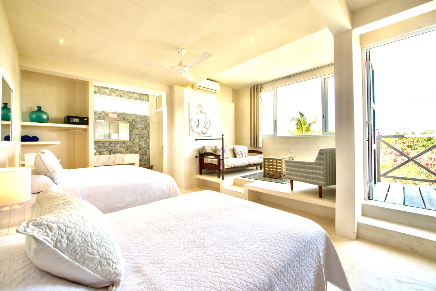 Spacious lagoon-view room with sitting area and garden views