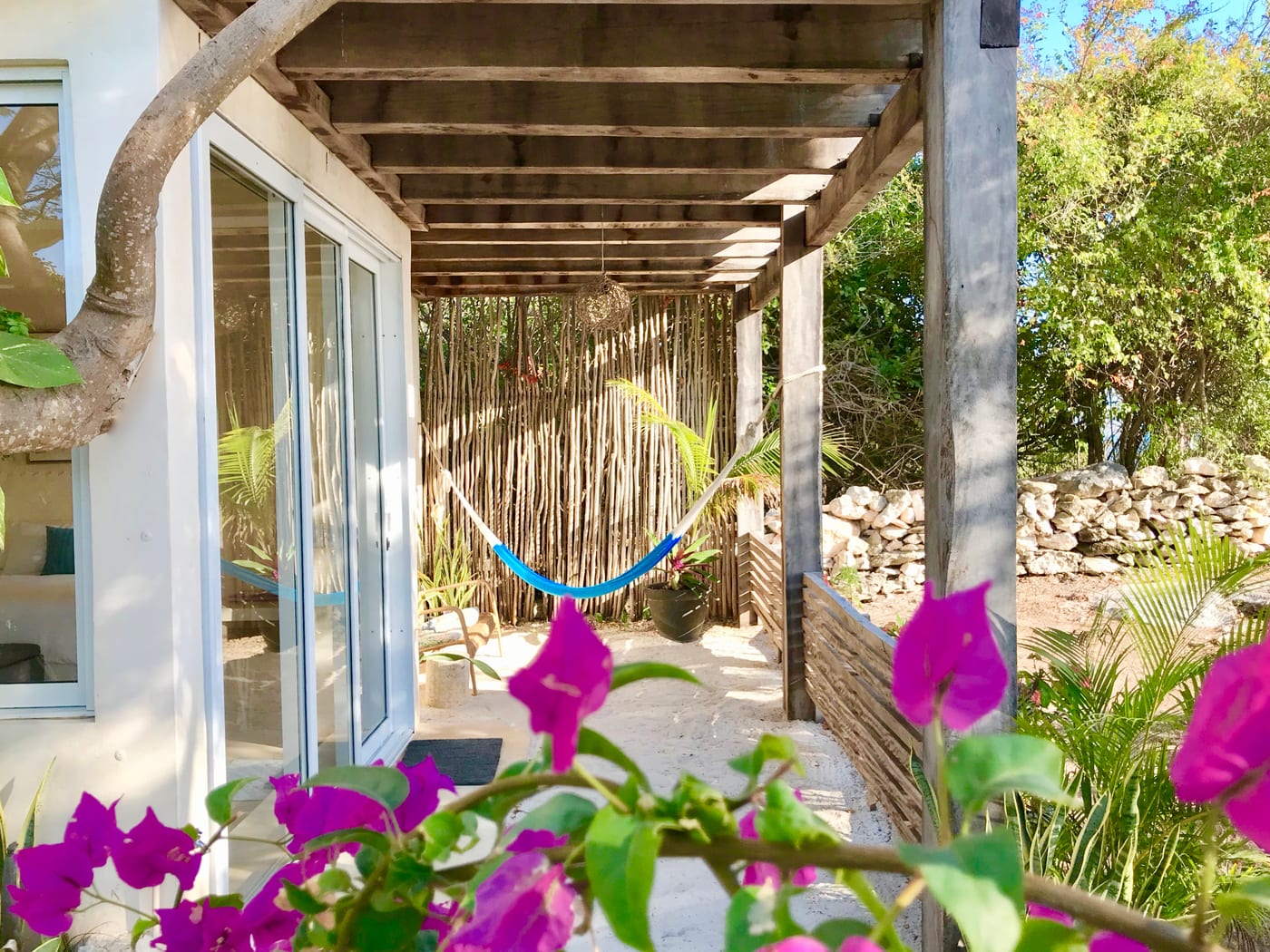 Covered terrace steps from the ocean